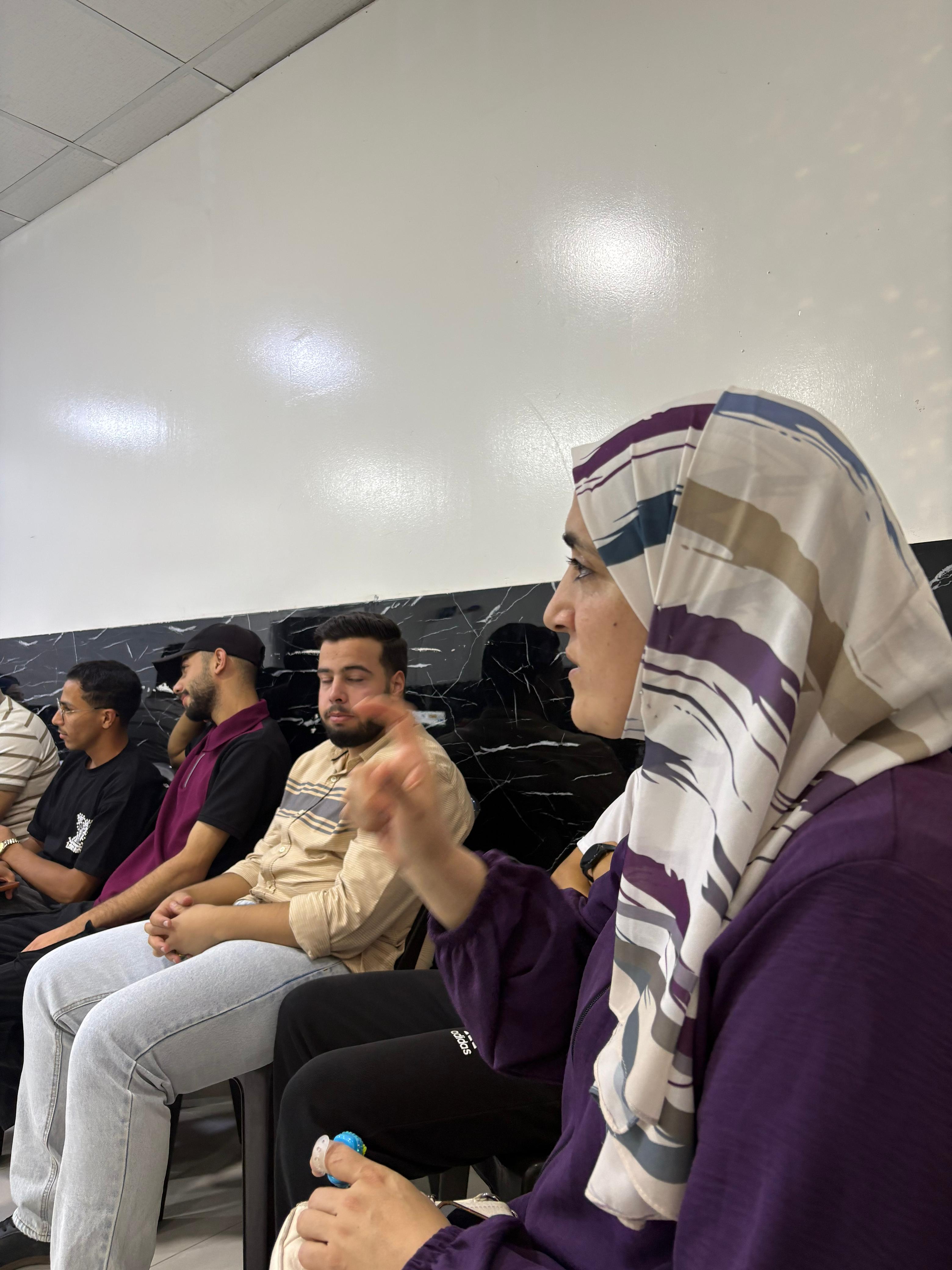 A participant speaking during a discussion after a regional film screening