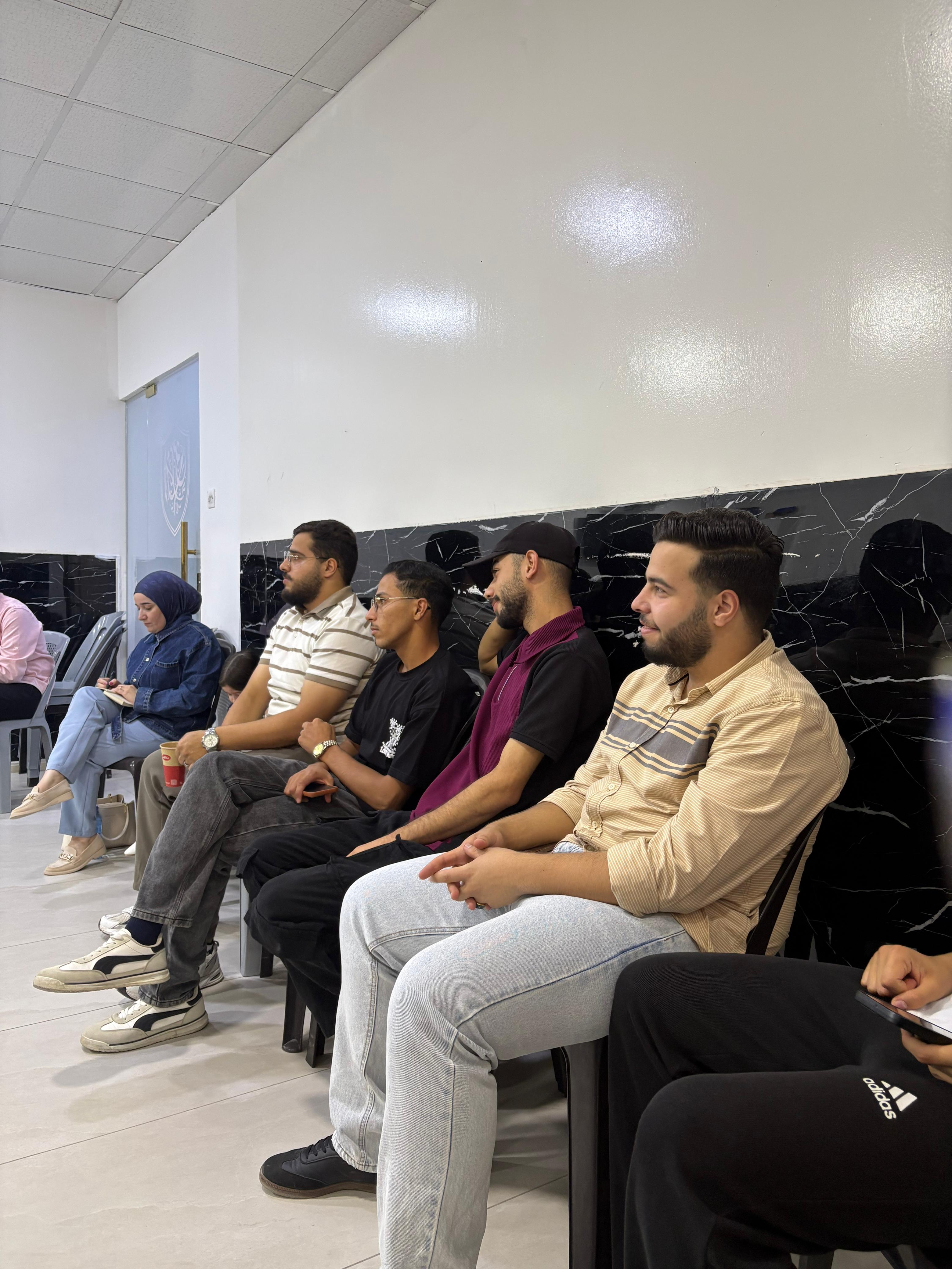 Young men and a woman in the audience at a community screening